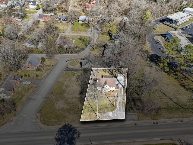 birds eye view of property with a residential view