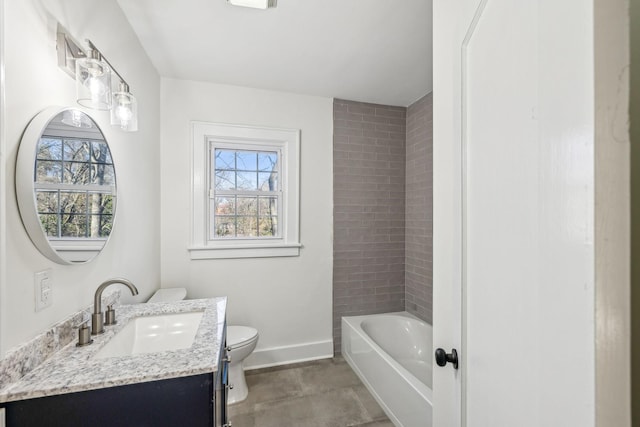 full bathroom featuring toilet, plenty of natural light, baseboards, and vanity