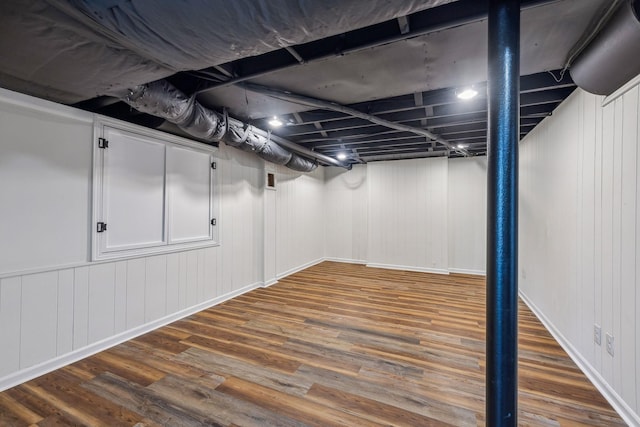 finished basement featuring wood finished floors