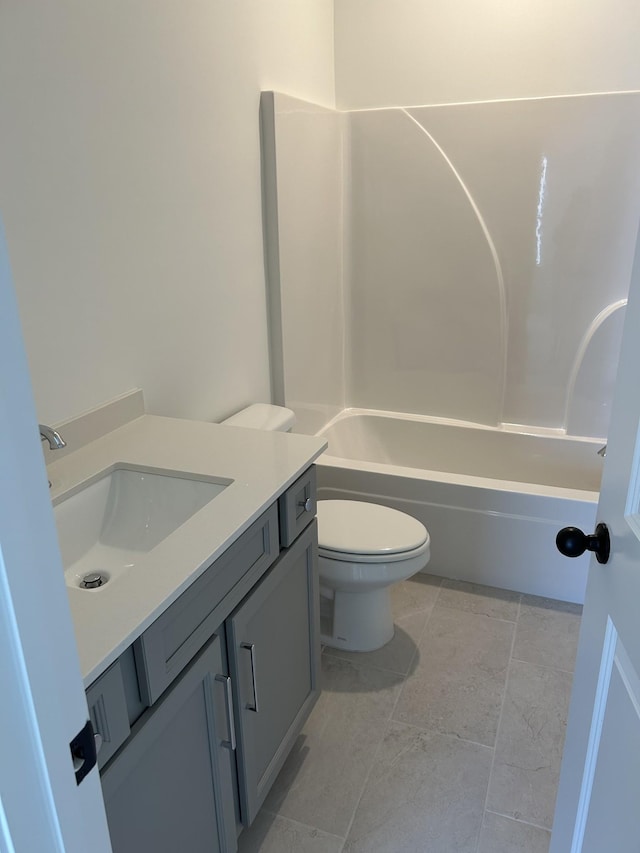 bathroom with toilet, shower / bathtub combination, and vanity