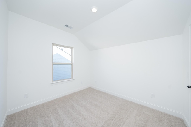 bonus room with vaulted ceiling, carpet, and baseboards