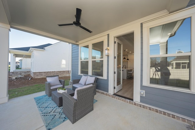 view of patio with outdoor lounge area and a ceiling fan