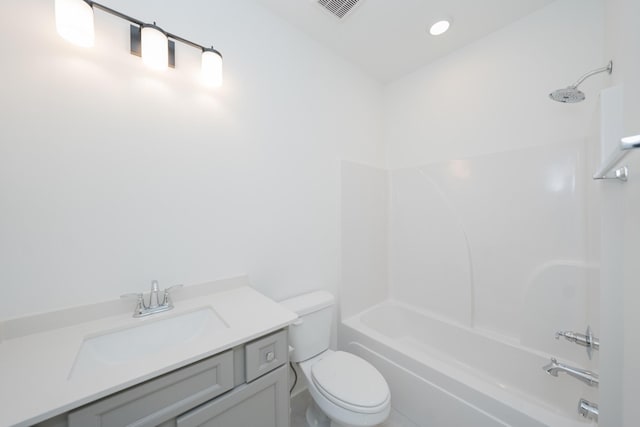 full bath with visible vents, shower / bath combination, vanity, and toilet