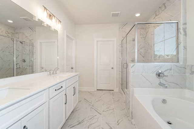 bathroom featuring marble finish floor, a garden tub, visible vents, a stall shower, and a sink