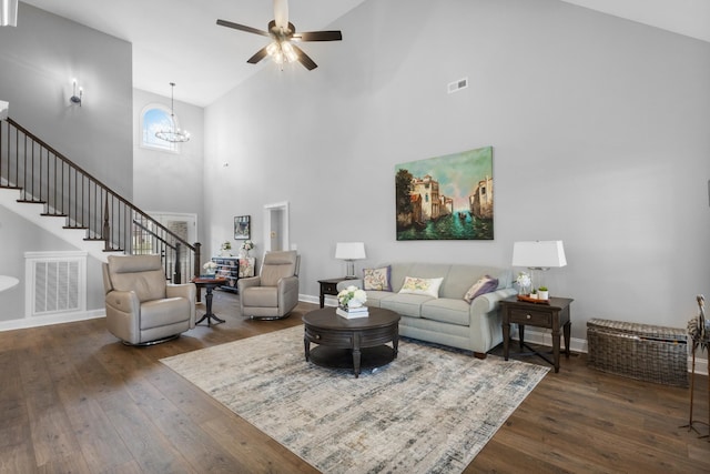 living area featuring hardwood / wood-style flooring, stairs, and visible vents