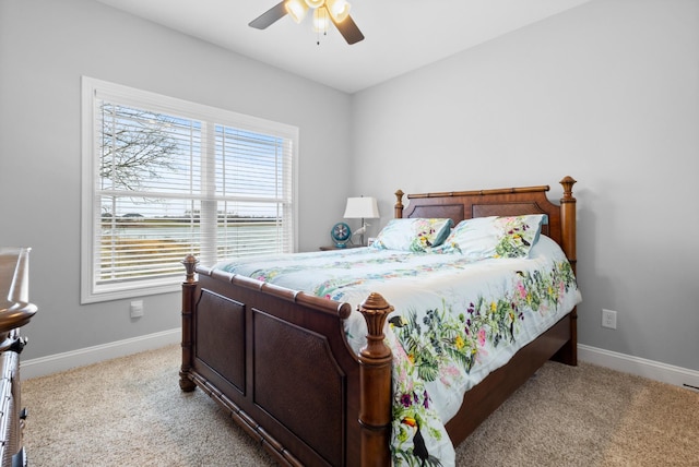 bedroom with carpet floors, ceiling fan, and baseboards