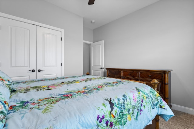 carpeted bedroom with a closet, a ceiling fan, and baseboards