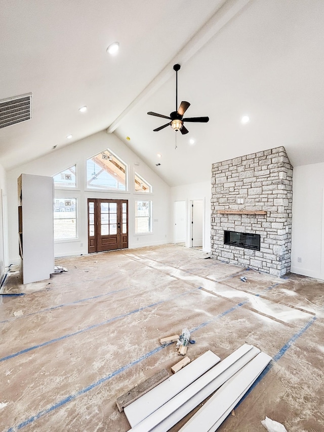 unfurnished living room featuring high vaulted ceiling, plenty of natural light, visible vents, and beam ceiling