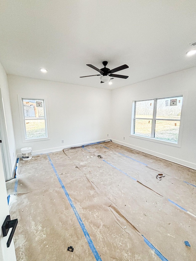 unfurnished room featuring recessed lighting, visible vents, and baseboards