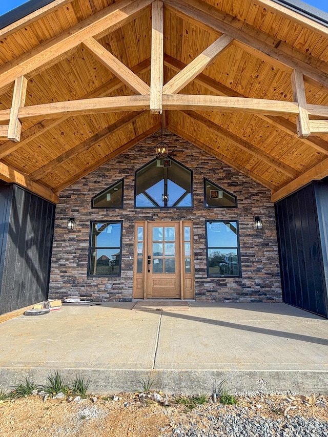 entrance to property featuring stone siding