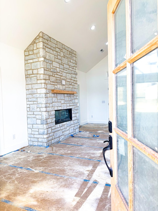 living area with a stone fireplace, recessed lighting, visible vents, baseboards, and vaulted ceiling