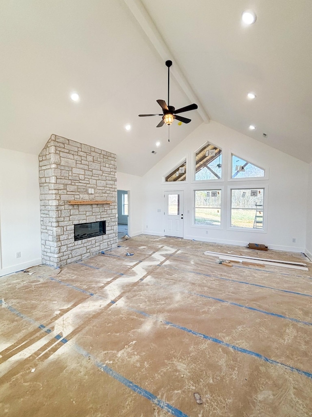 unfurnished living room featuring recessed lighting, beamed ceiling, a fireplace, and baseboards