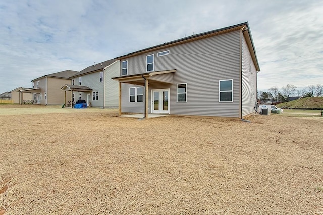 back of property featuring french doors and a patio