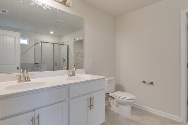 full bath with toilet, a stall shower, double vanity, and a sink