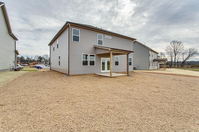 back of house featuring french doors and a patio