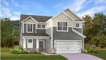 view of front of property featuring a front yard, driveway, and an attached garage