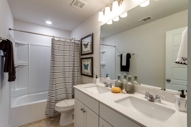 bathroom featuring visible vents, a sink, and toilet