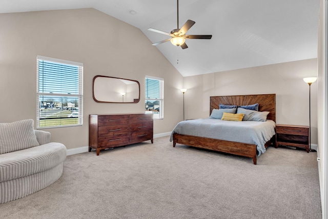 bedroom featuring baseboards, high vaulted ceiling, ceiling fan, and light colored carpet