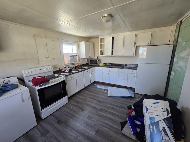 kitchen featuring open shelves, dark countertops, dark wood-type flooring, washer / dryer, and white appliances