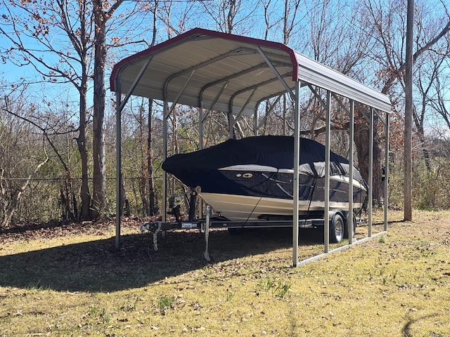 view of parking featuring a detached carport and fence