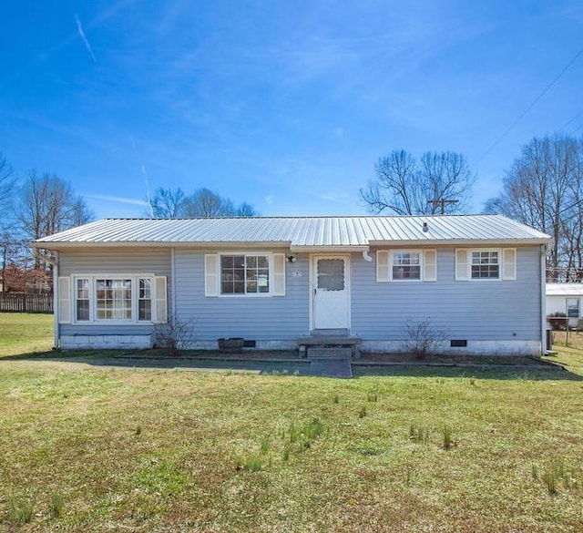 ranch-style house featuring crawl space, entry steps, metal roof, and a front yard