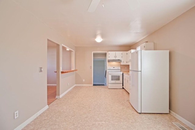 kitchen with visible vents, white cabinets, white appliances, under cabinet range hood, and baseboards