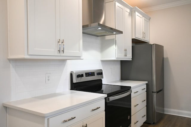 kitchen featuring stainless steel appliances, light countertops, ornamental molding, wall chimney range hood, and decorative backsplash
