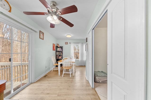 interior space featuring light wood-style floors and baseboards