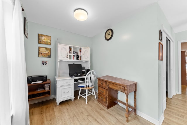 home office featuring light wood-style flooring and baseboards