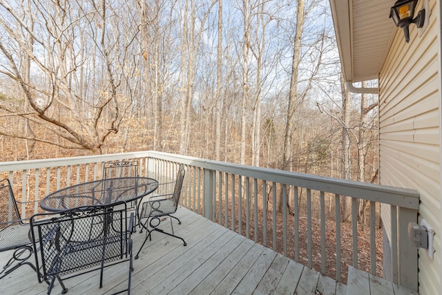 wooden deck with outdoor dining area