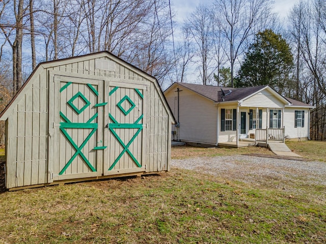 view of shed featuring a porch