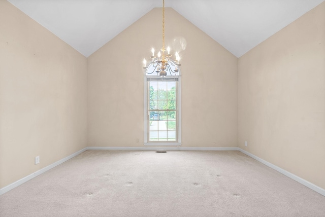 carpeted empty room with a chandelier, lofted ceiling, visible vents, and baseboards