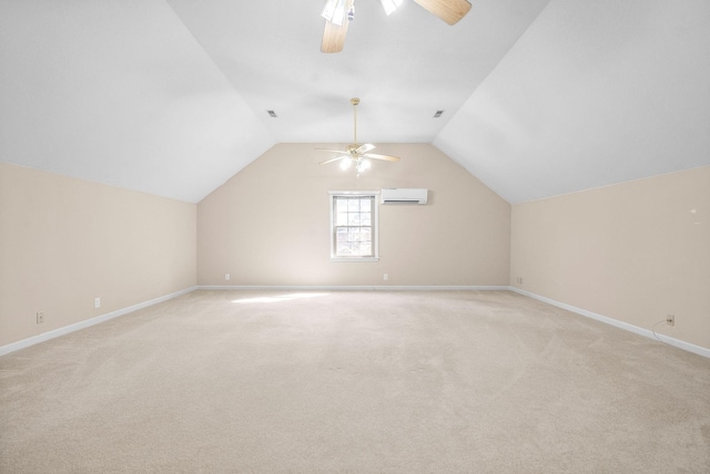 additional living space with light carpet, baseboards, a ceiling fan, lofted ceiling, and an AC wall unit