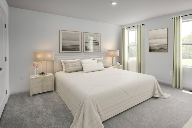 bedroom with carpet flooring, multiple windows, and baseboards