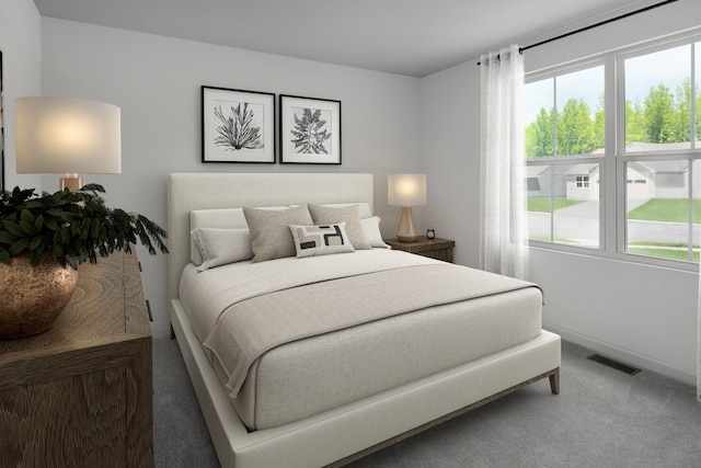 carpeted bedroom featuring visible vents