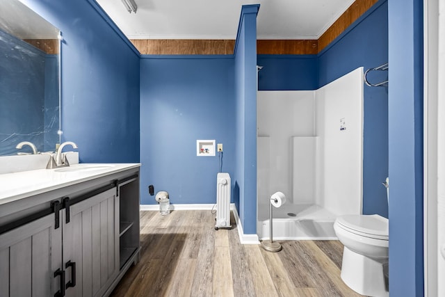 full bathroom featuring a shower, radiator, toilet, vanity, and wood finished floors