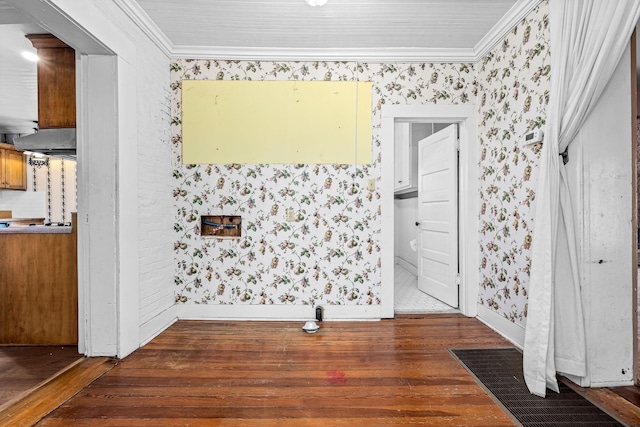 interior space featuring ornamental molding, wood finished floors, baseboards, and wallpapered walls