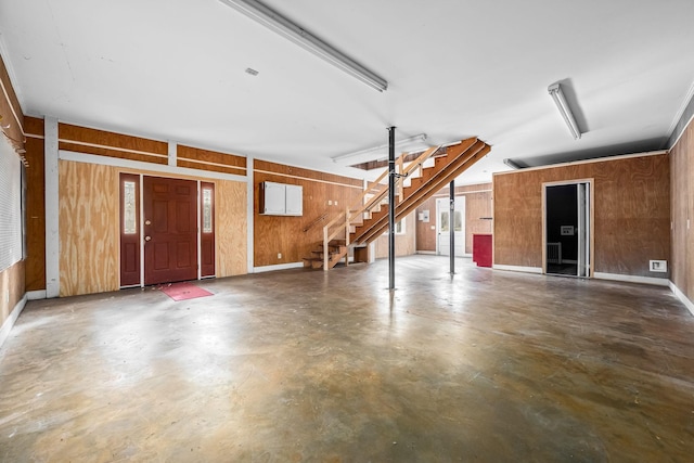 garage featuring wooden walls