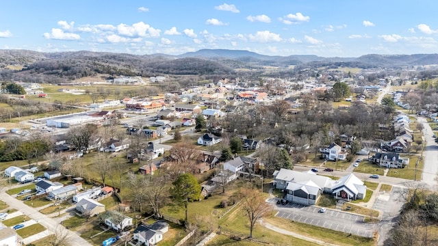 drone / aerial view featuring a residential view and a mountain view