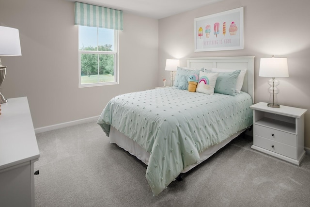 carpeted bedroom featuring baseboards