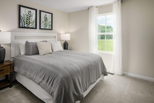 carpeted bedroom with baseboards