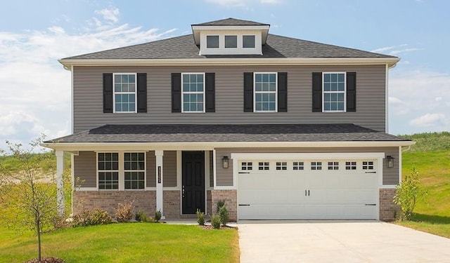 view of front of property with a garage, concrete driveway, brick siding, and a front lawn