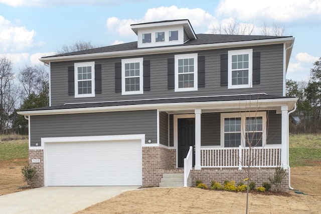 view of front facade with brick siding, covered porch, concrete driveway, and an attached garage