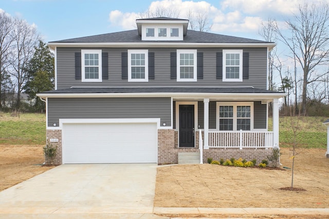 view of front of property featuring brick siding, covered porch, a garage, and driveway