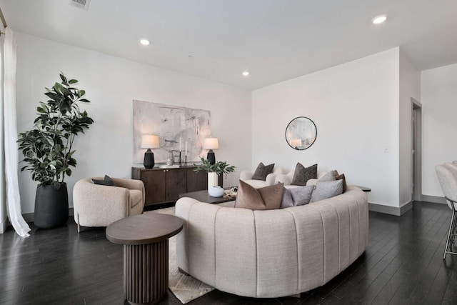 living room featuring dark wood-style floors, recessed lighting, and visible vents