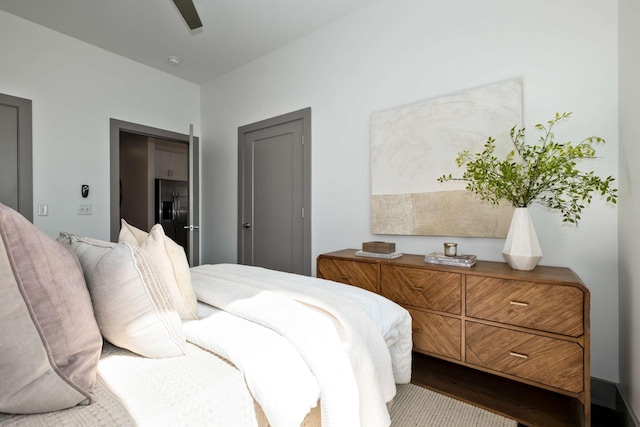 bedroom featuring ceiling fan and wood finished floors