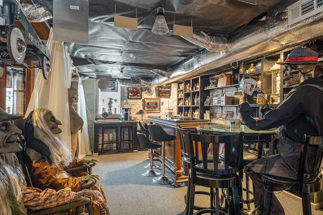 bar with a dry bar, carpet, and visible vents