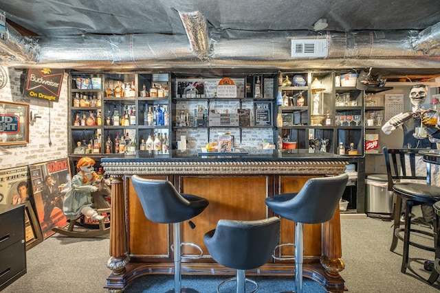 bar featuring carpet floors, a bar, and visible vents