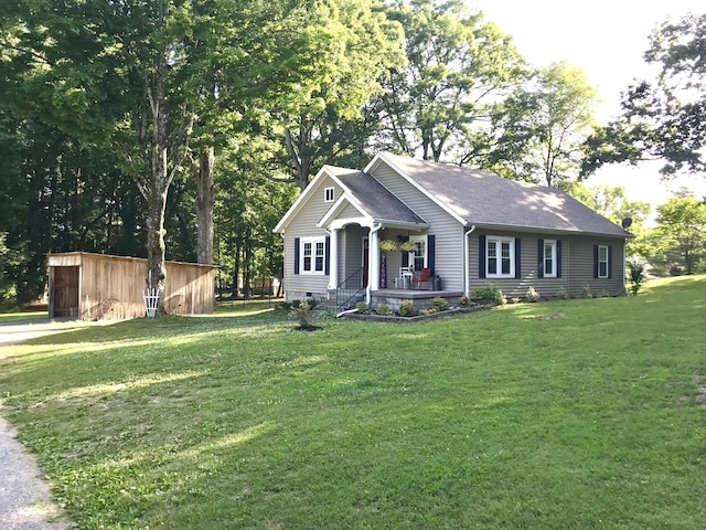 view of front of home featuring a front yard, covered porch, and crawl space