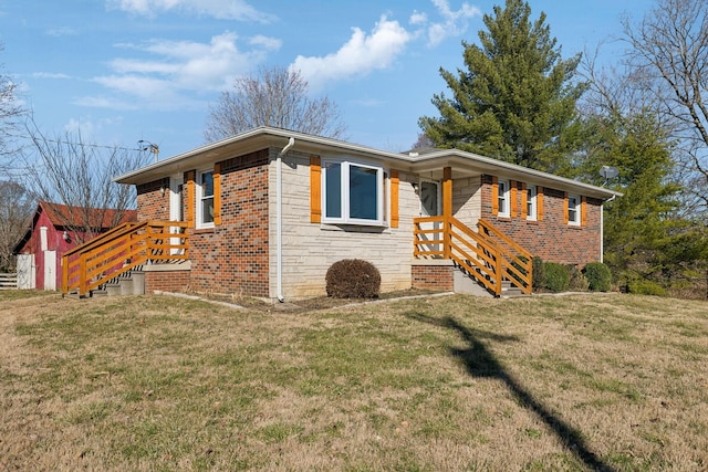 single story home with brick siding and a front lawn